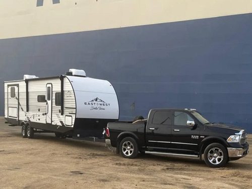 Tow vehicle and caravan hitched for safe weight check in Australia
